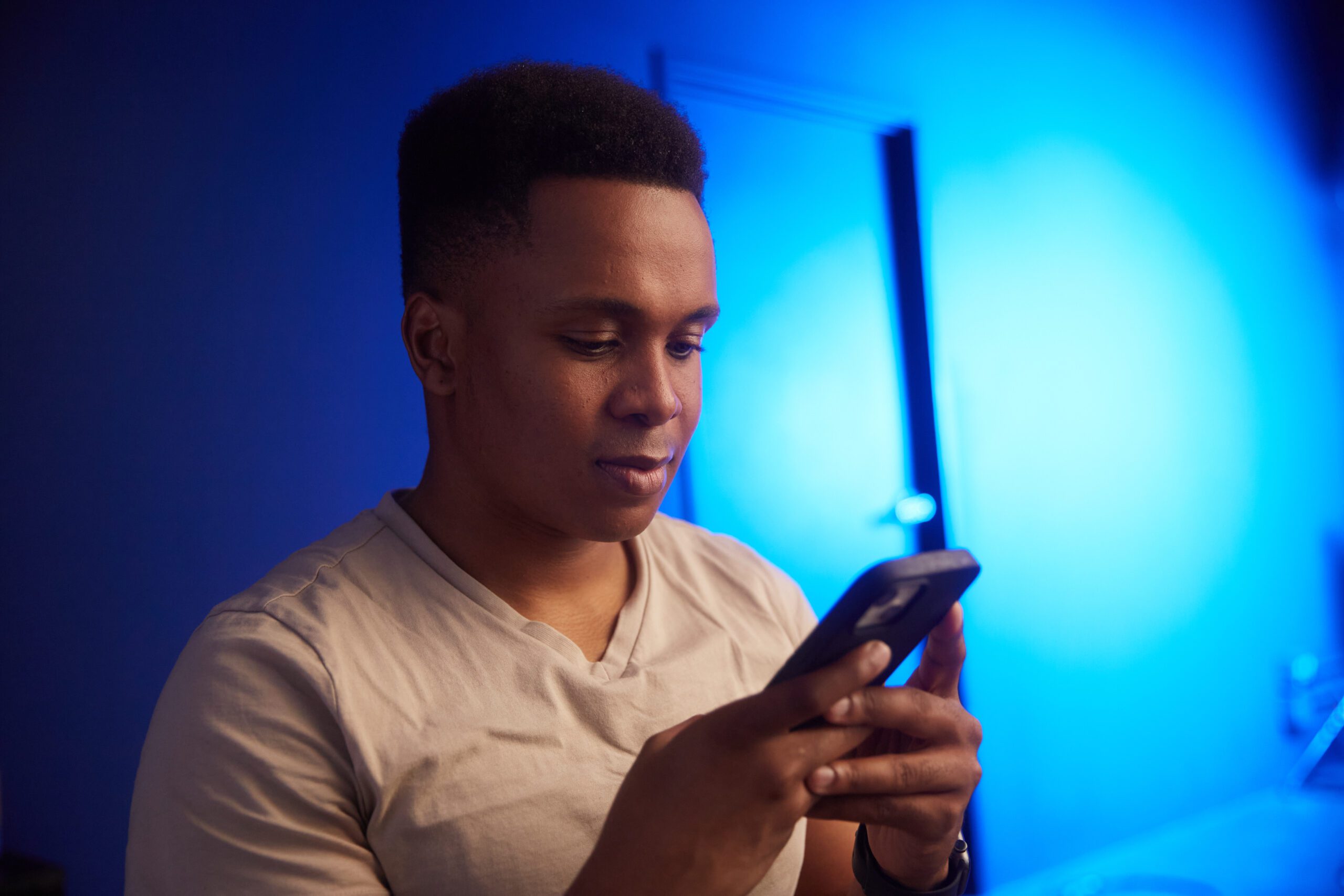 An actor looking at his smartphone