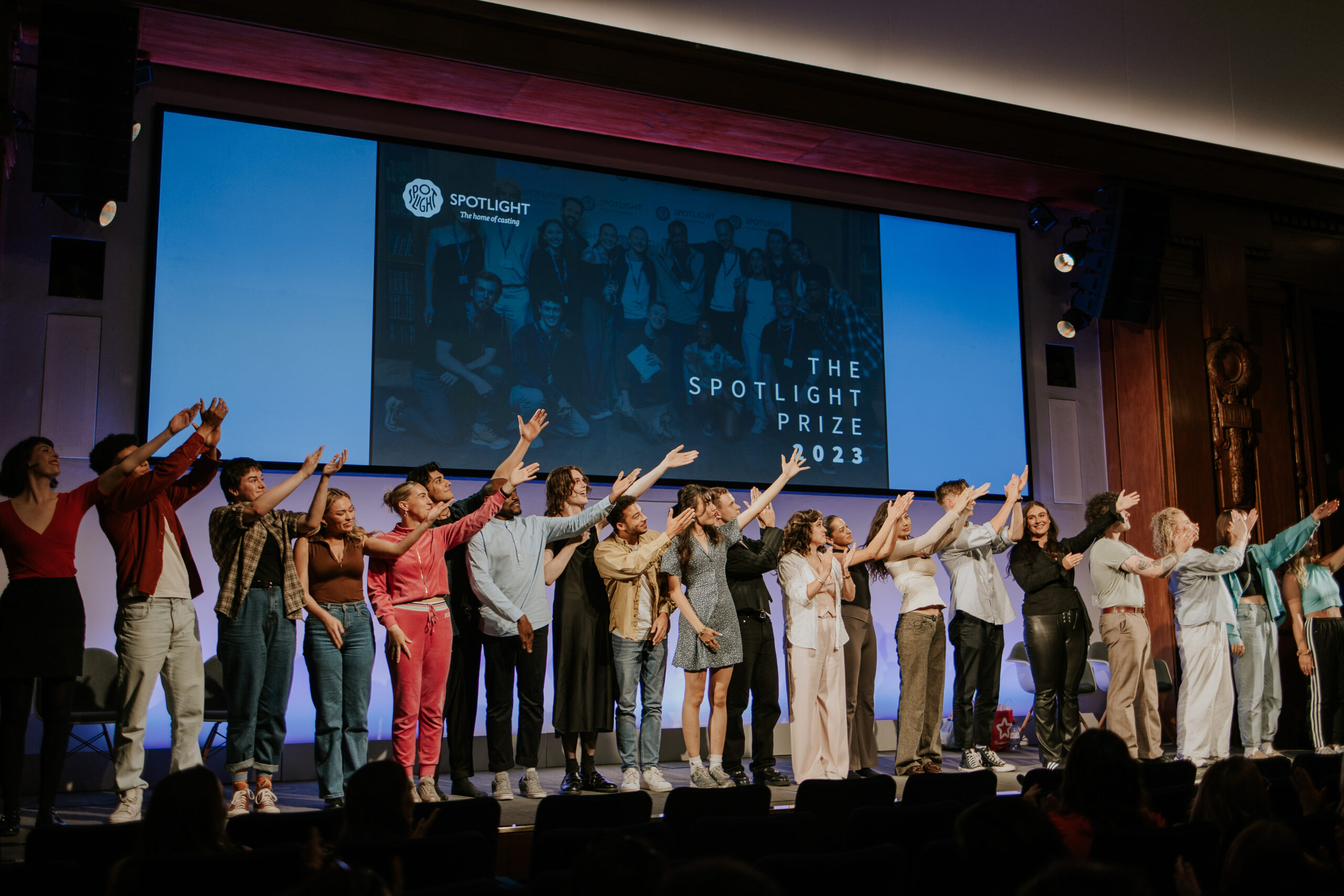 The nominees of the Spotlight Prize 2023 lined up on stage extending their arm