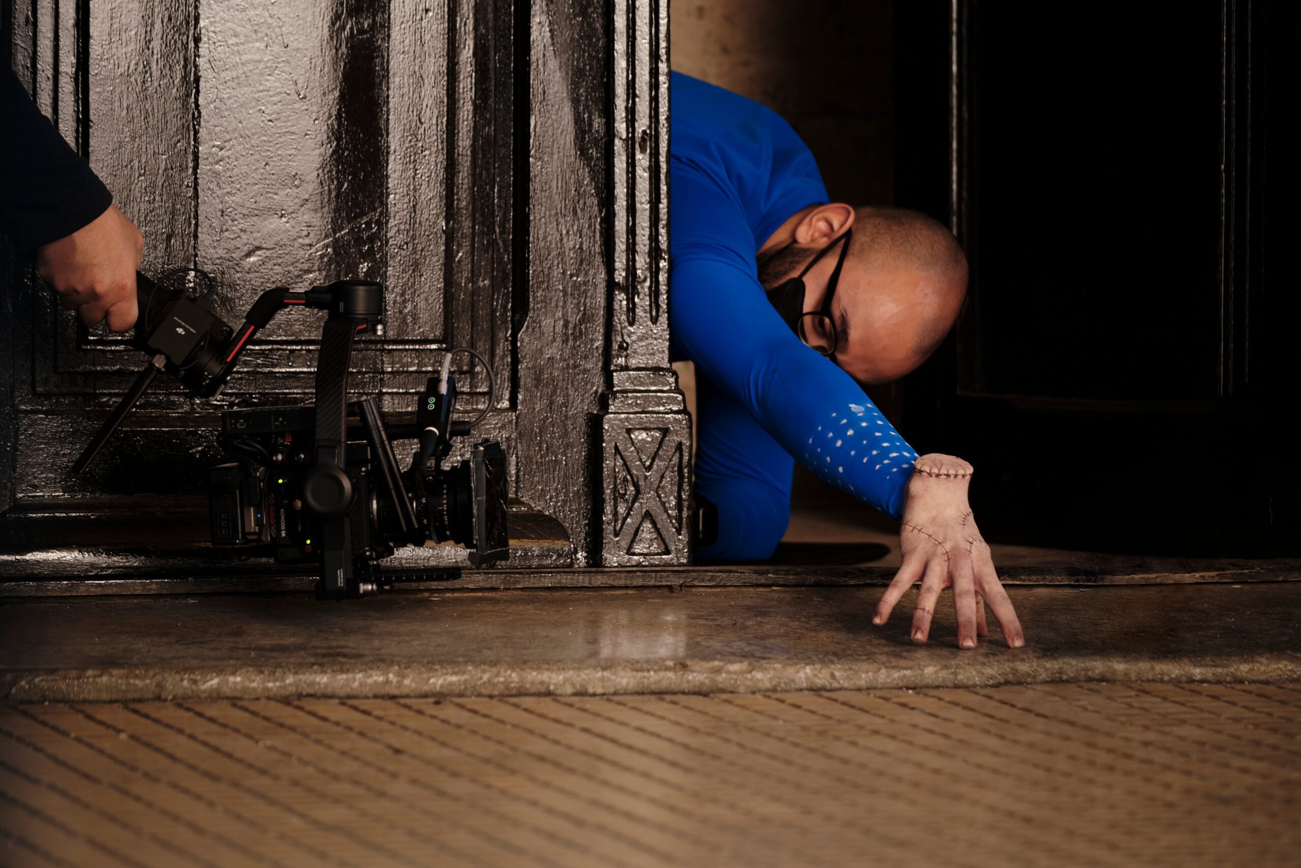 Victor Teodor Dorobantu as 'Thing' on the set of 'Wednesday'