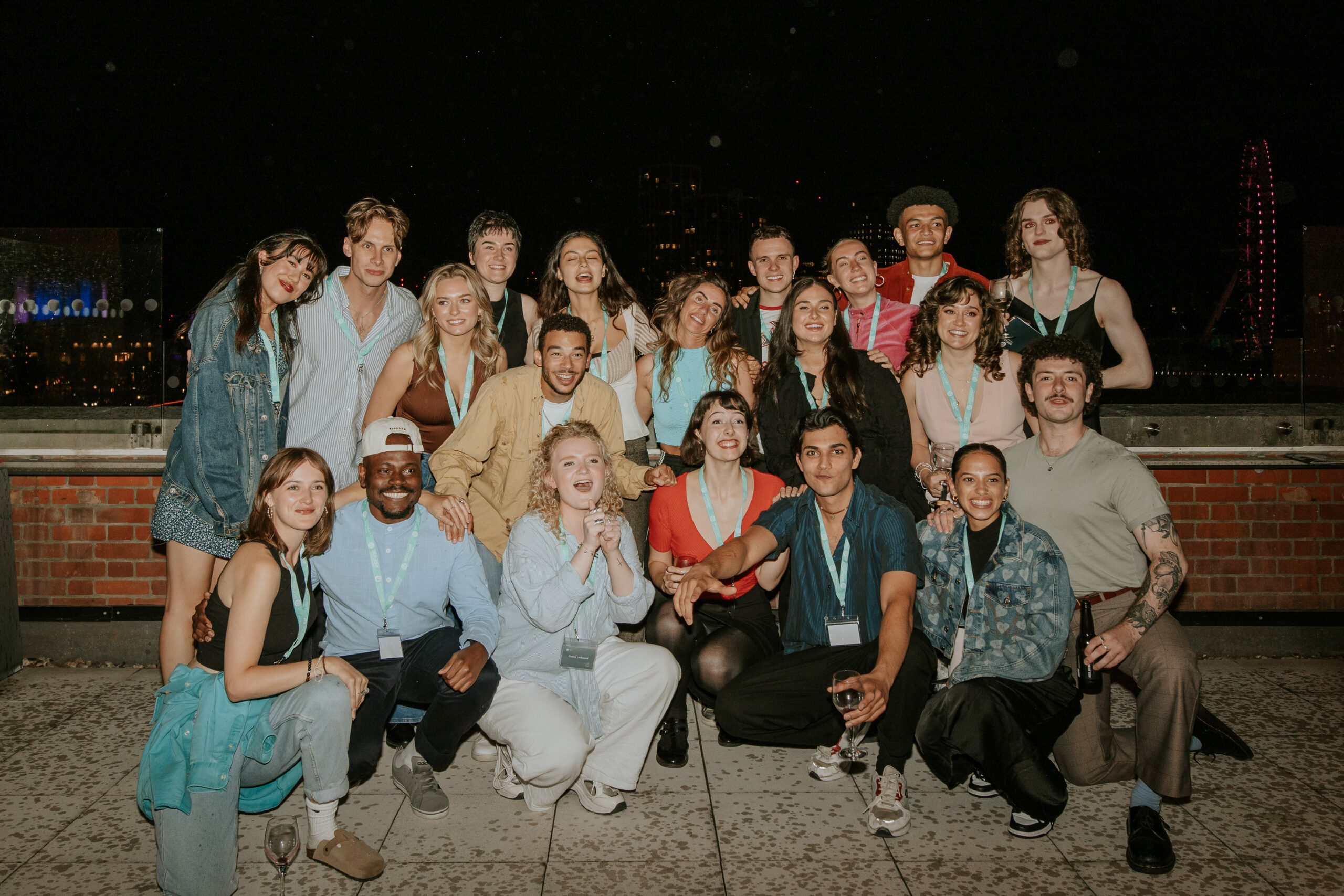 A group of performers poising for a picture.