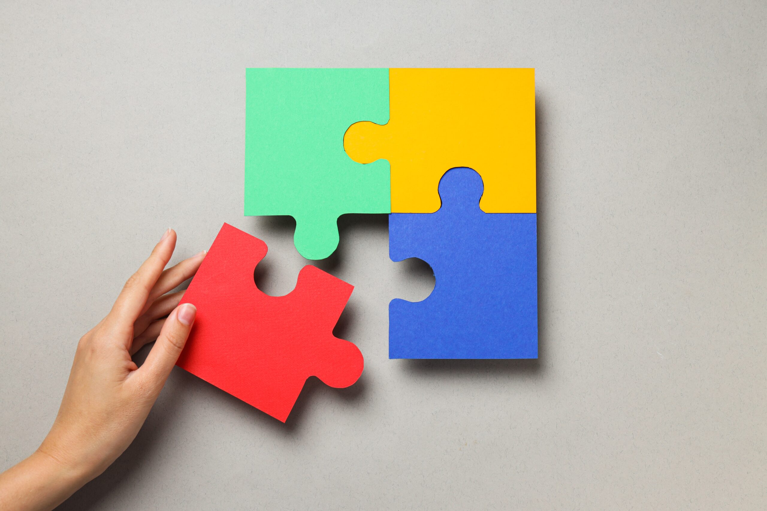 The last of 4 colourful puzzle pieces being put together for Autistic Awareness